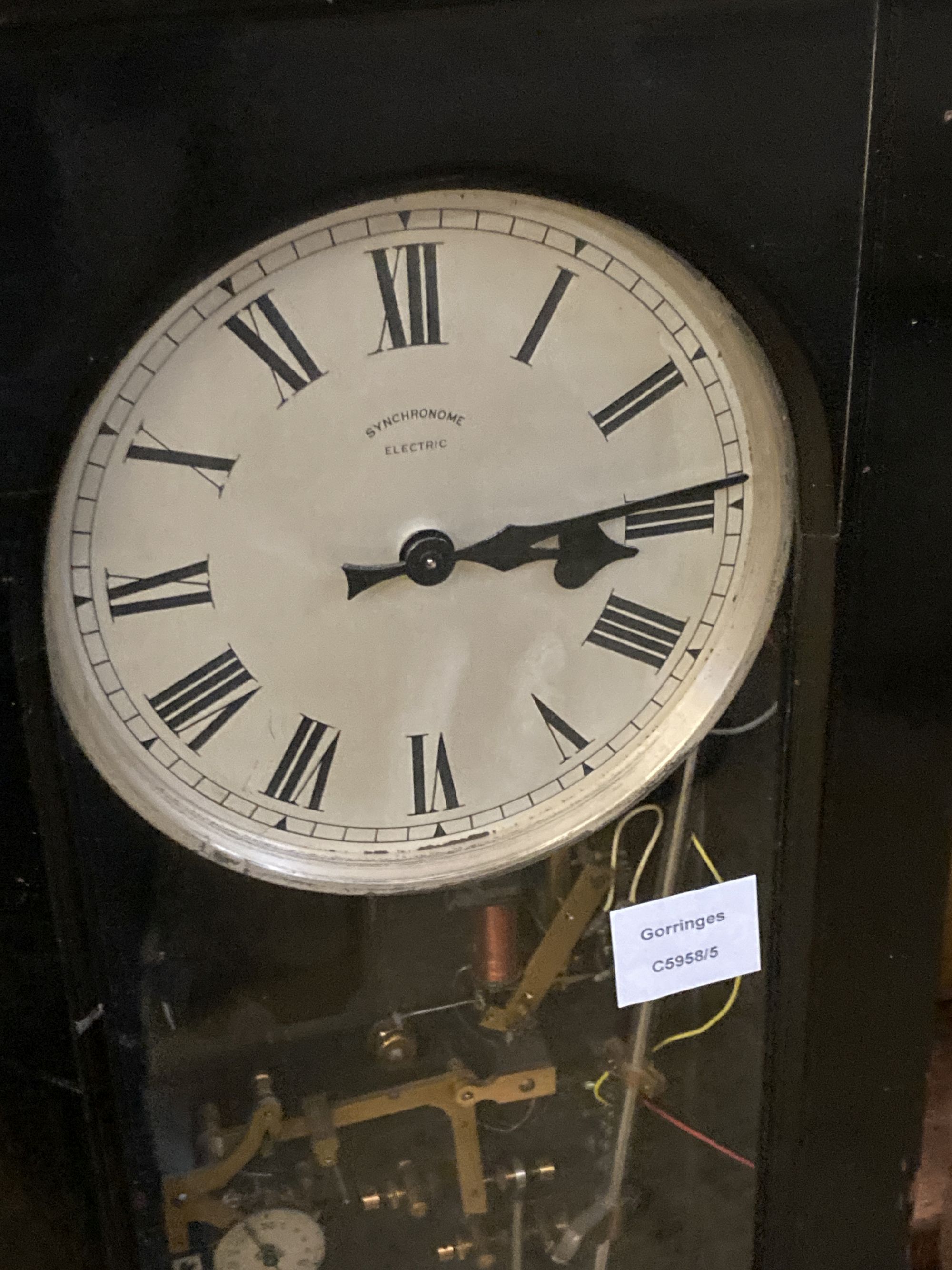 A Synchronome electric pendulum master clock, in an ebonised case, height 128cm